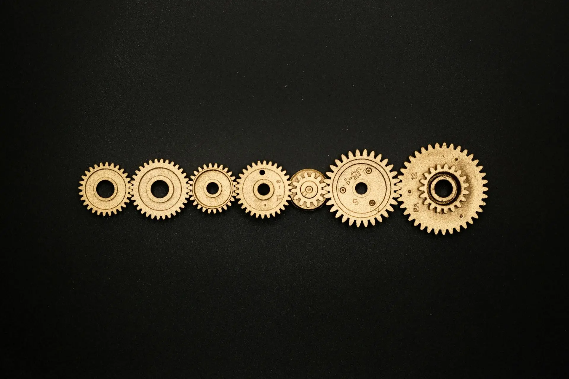 Beige cogs lined up